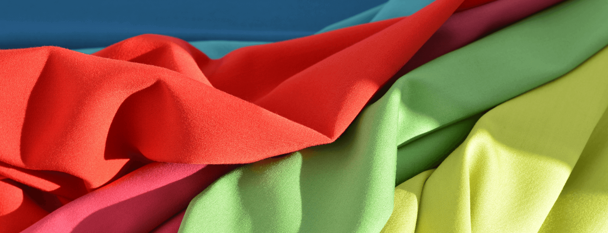 Bright synthetic fabrics of different colored placed over each other